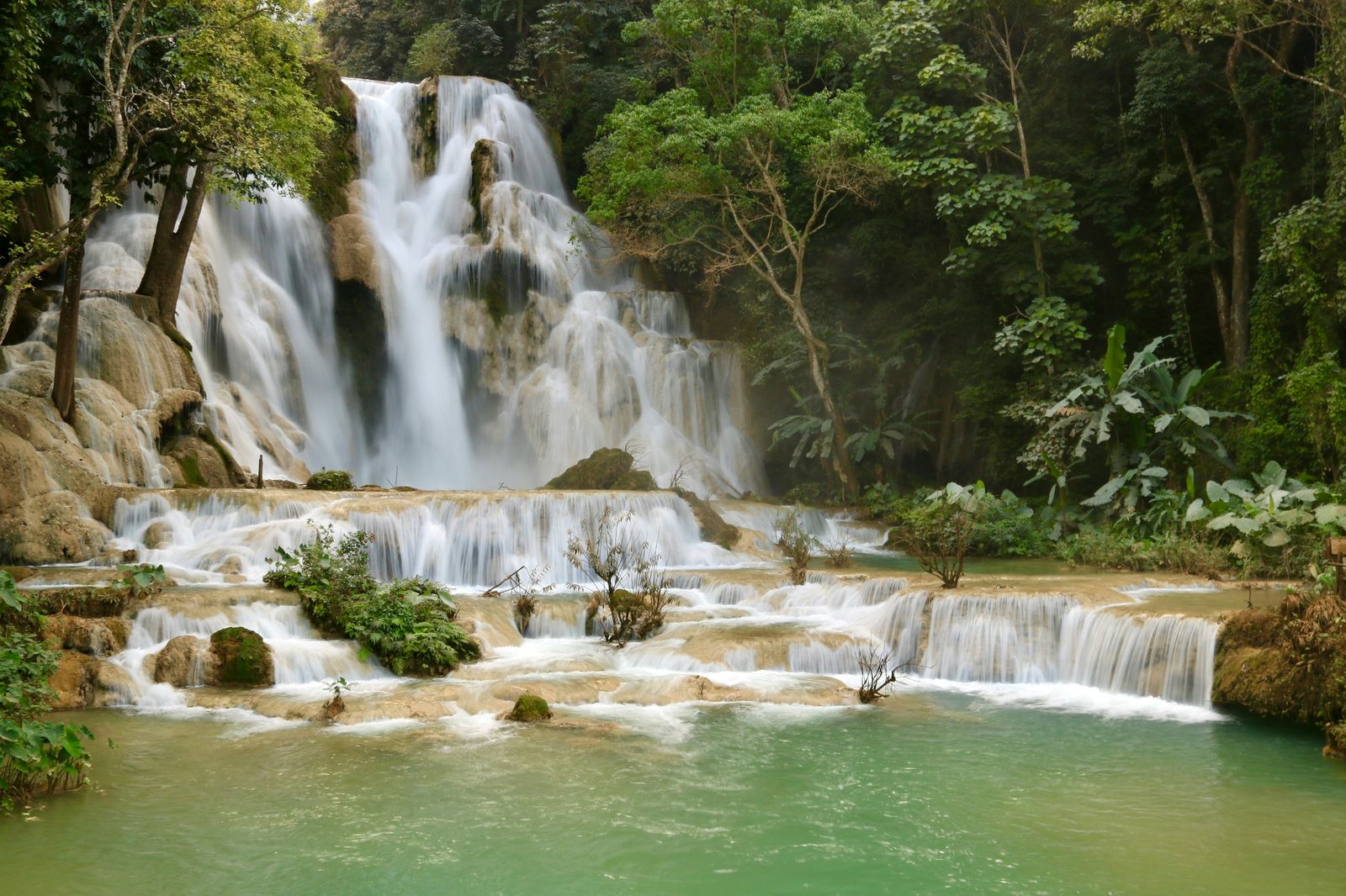Kuang Si waterfall tumbling into turquoise pools near Luang Prabang, Laos